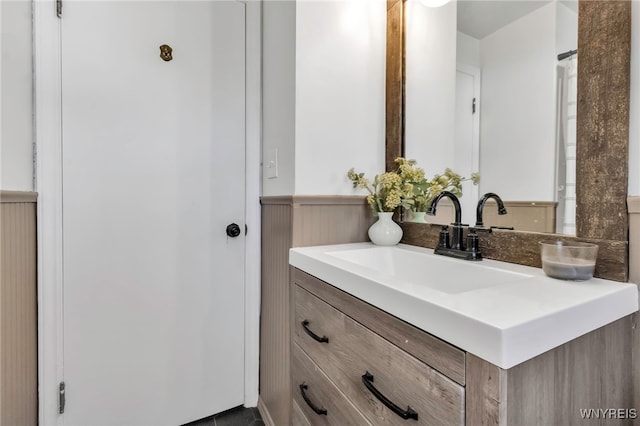 bathroom featuring vanity and wainscoting