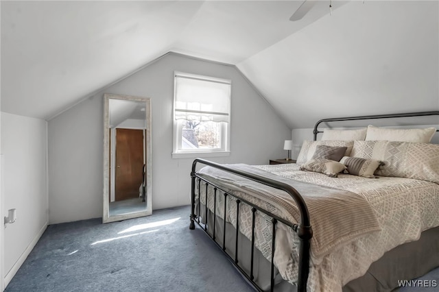 bedroom with ceiling fan, carpet, and vaulted ceiling