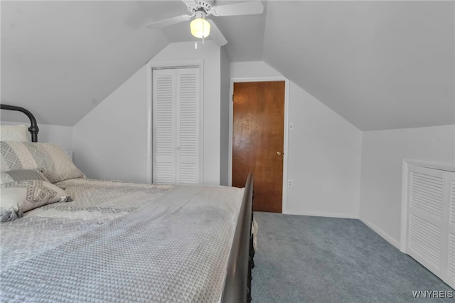carpeted bedroom with a closet, baseboards, a ceiling fan, and vaulted ceiling