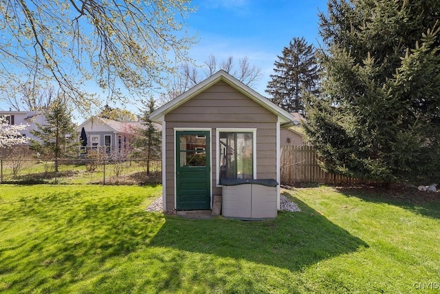 view of shed featuring fence