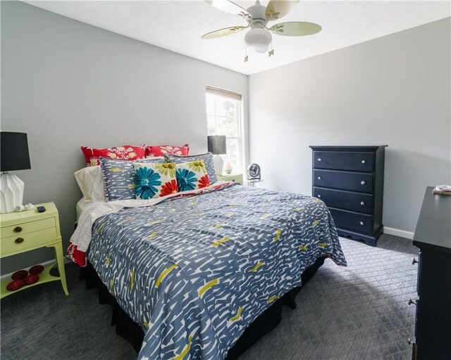 carpeted bedroom featuring a ceiling fan