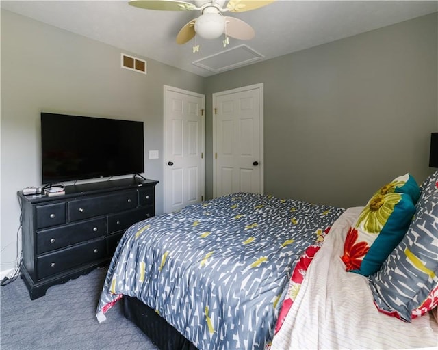 carpeted bedroom with visible vents and ceiling fan