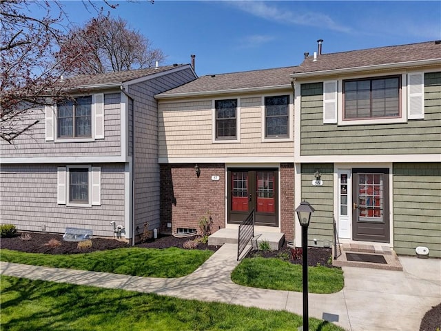 view of front of house featuring french doors and a front lawn