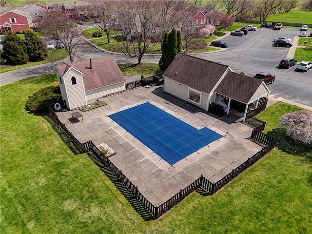 view of pool with a fenced in pool, a fenced backyard, a patio area, and a lawn