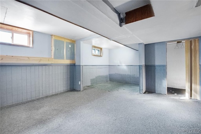 basement with carpet floors and wainscoting