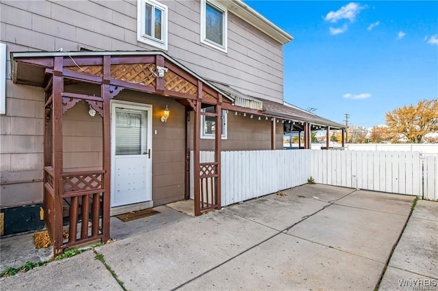 exterior space with a patio and fence