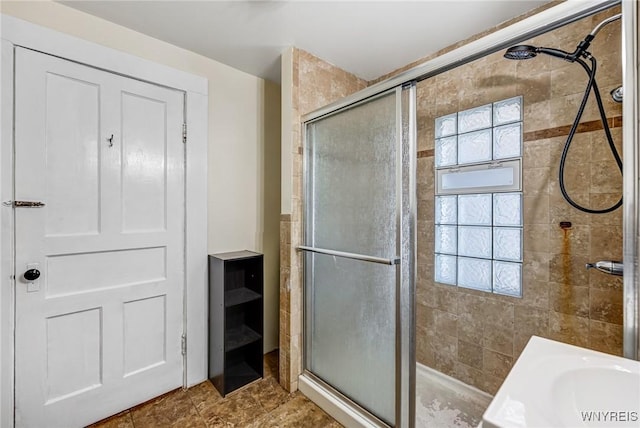 full bath with a shower stall