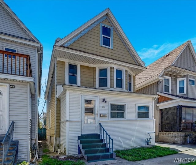american foursquare style home with entry steps