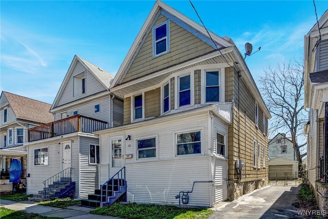 american foursquare style home with entry steps