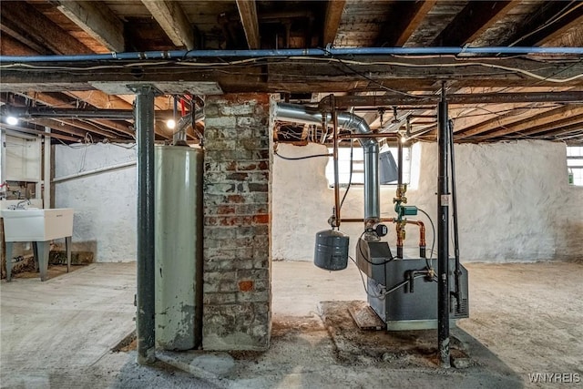 below grade area with a sink and gas water heater
