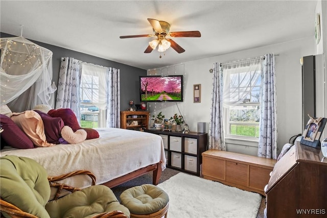 carpeted bedroom featuring a ceiling fan