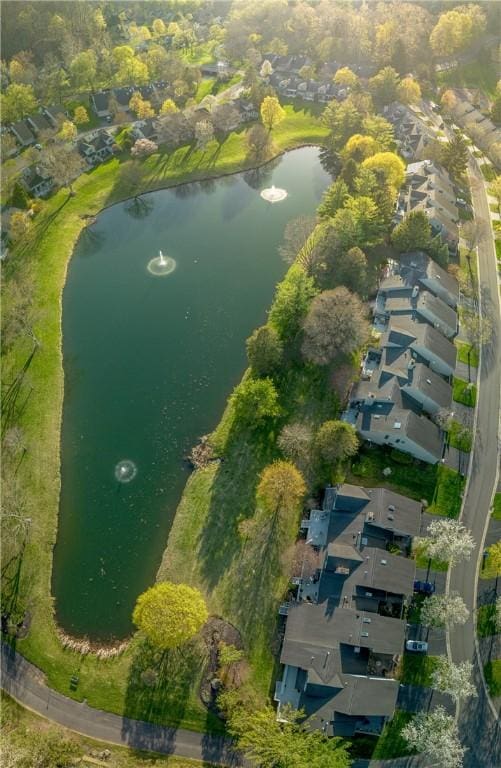 drone / aerial view featuring a water view and a residential view