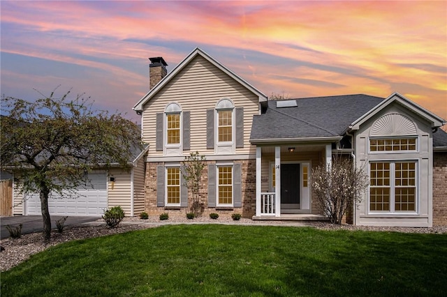 view of front facade featuring a chimney, a shingled roof, a garage, a yard, and concrete driveway