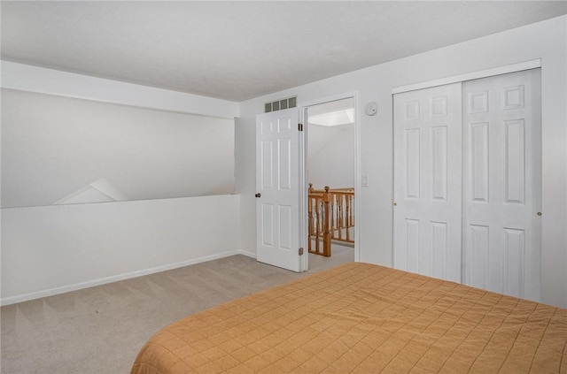 bedroom featuring visible vents, carpet, and baseboards