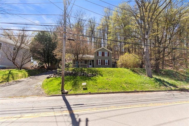 traditional-style home with a front lawn