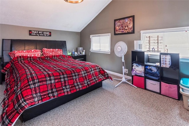 carpeted bedroom with baseboards and lofted ceiling