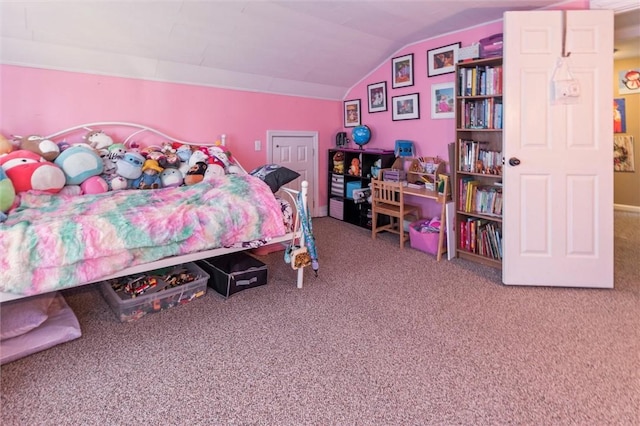 carpeted bedroom with lofted ceiling