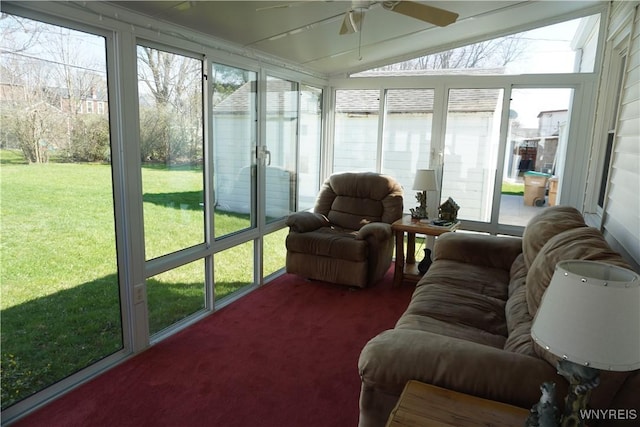 sunroom with a ceiling fan