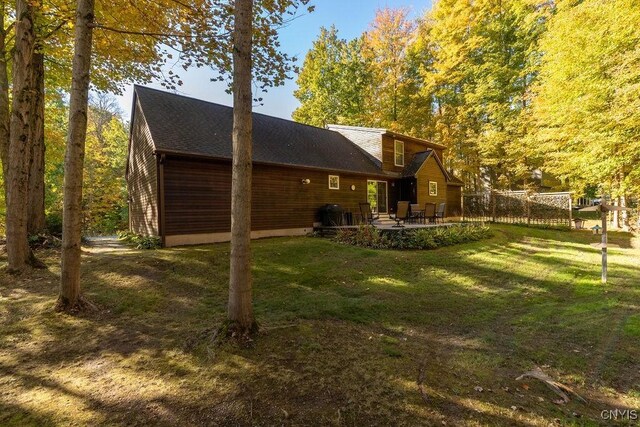 rear view of house with a yard and a patio area