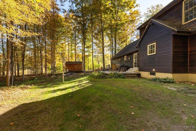 view of yard with entry steps and a patio area