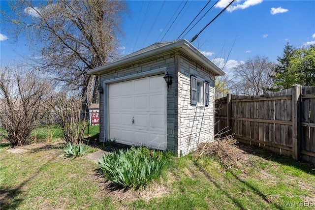 garage with fence