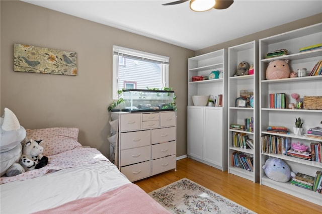 bedroom with ceiling fan and light wood-type flooring