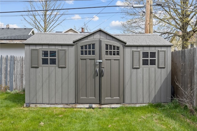 view of shed with fence