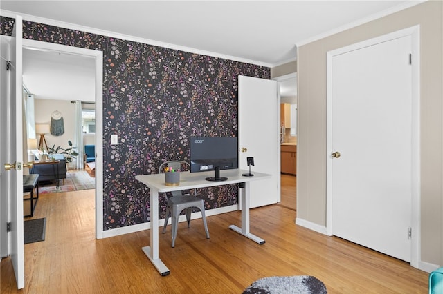 home office with baseboards, wallpapered walls, ornamental molding, and wood finished floors