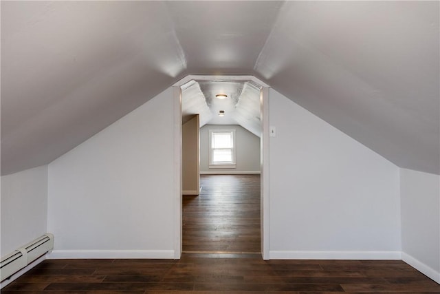 bonus room with vaulted ceiling, baseboards, a baseboard heating unit, and wood finished floors