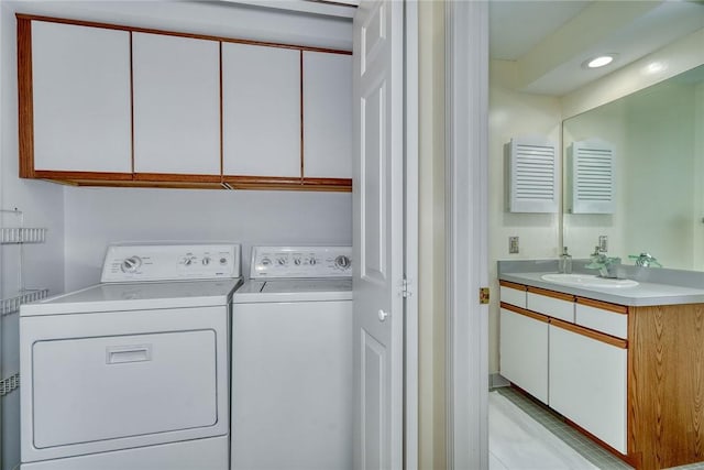 clothes washing area featuring laundry area, recessed lighting, a sink, independent washer and dryer, and light tile patterned floors