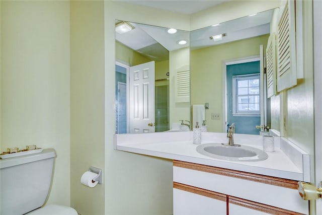 bathroom with vanity and toilet
