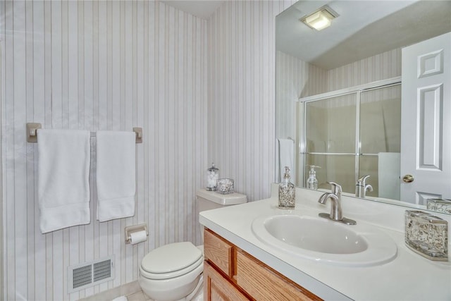 full bathroom with visible vents, vanity, toilet, wallpapered walls, and a stall shower