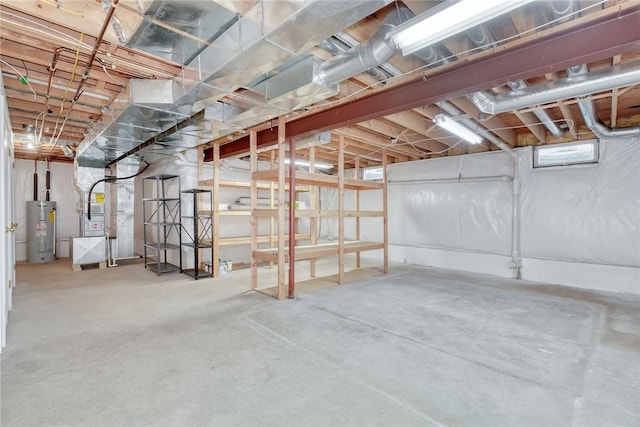 unfinished basement with heating unit and water heater