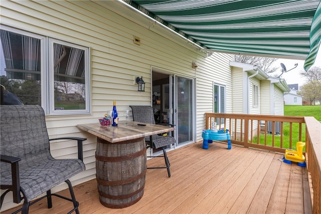 wooden deck with outdoor dining space