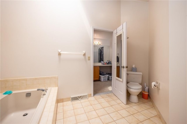 full bathroom featuring visible vents, toilet, tile patterned floors, a bath, and french doors