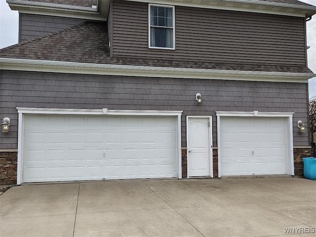 garage featuring driveway