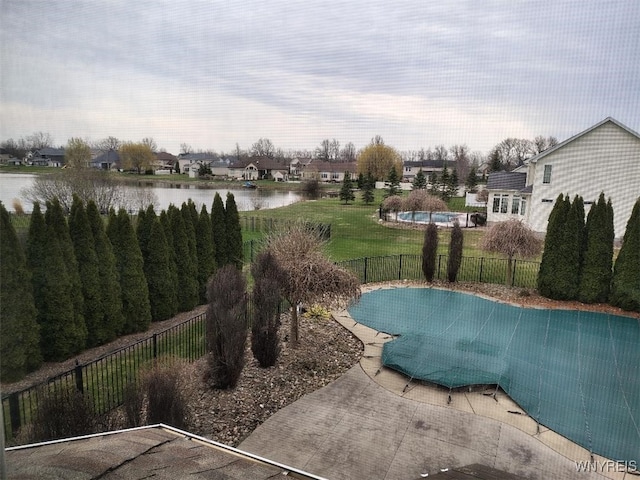 view of swimming pool featuring a water view, a fenced in pool, and a fenced backyard