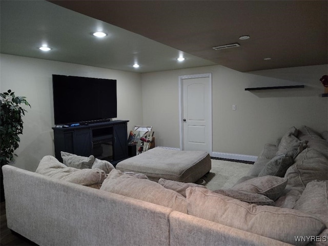 living room featuring baseboards, recessed lighting, and visible vents