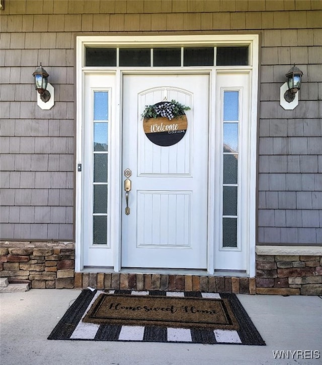 property entrance with stone siding