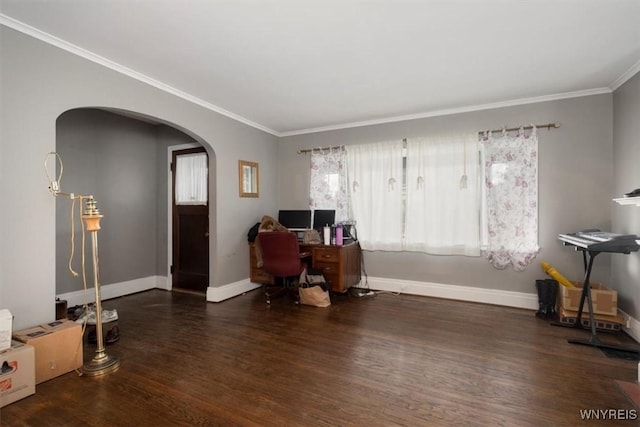 office area with crown molding, arched walkways, baseboards, and wood finished floors