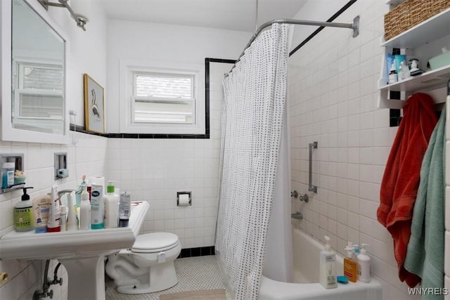 bathroom featuring toilet, tile walls, tile patterned flooring, and shower / tub combo with curtain
