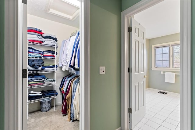 spacious closet featuring tile patterned floors
