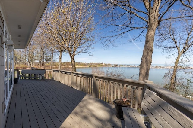 wooden terrace with a water view