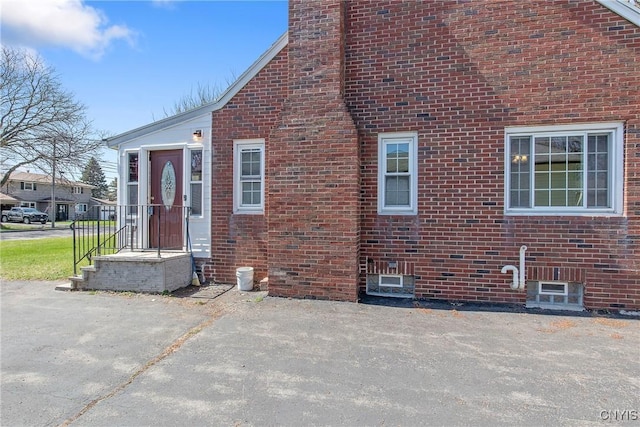 view of side of property with brick siding