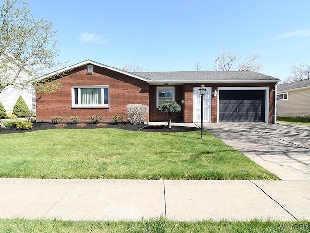 ranch-style home with brick siding, a garage, a front lawn, and concrete driveway