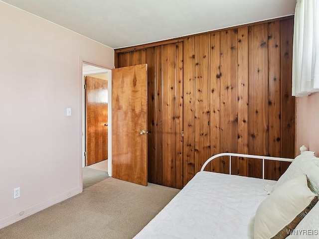 bedroom with carpet floors and baseboards