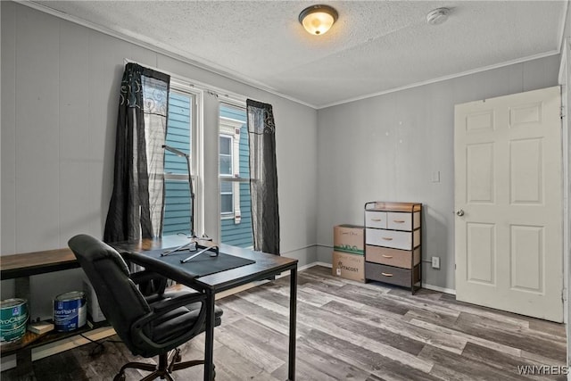 office featuring crown molding, a textured ceiling, and wood finished floors
