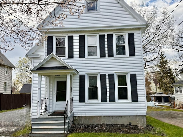 view of front of property featuring fence