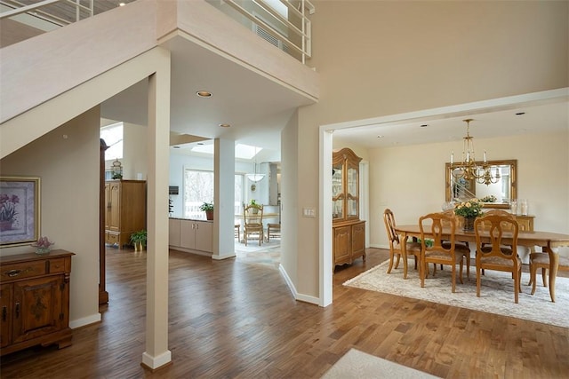 dining room with baseboards and wood finished floors