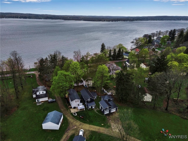 drone / aerial view featuring a water view and a residential view